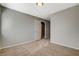 Bedroom featuring plush carpeting, neutral walls, and an open doorway at 5309 Tartan Hill Ave, Las Vegas, NV 89141