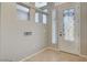 Entryway featuring a decorative glass door and a high ceiling with windows at 5309 Tartan Hill Ave, Las Vegas, NV 89141