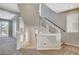 Hallway leading to an open living space, entryway, and stairway to upper level at 5309 Tartan Hill Ave, Las Vegas, NV 89141