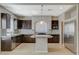 Modern kitchen with stainless steel appliances, granite countertops, and a mosaic backsplash at 5309 Tartan Hill Ave, Las Vegas, NV 89141
