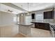 A kitchen island featuring granite countertops, pendant lighting, and stainless steel appliances at 5309 Tartan Hill Ave, Las Vegas, NV 89141