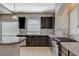 Modern kitchen featuring stainless steel appliances, granite countertops, and a mosaic backsplash at 5309 Tartan Hill Ave, Las Vegas, NV 89141