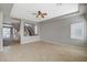 Large open-plan living area featuring tile floors and staircase view at 5309 Tartan Hill Ave, Las Vegas, NV 89141