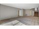 Large living area with carpet, staircase, and multiple entryways at 5309 Tartan Hill Ave, Las Vegas, NV 89141