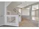 A staircase with carpeted steps and a glass panel railing leads to the upper level at 5309 Tartan Hill Ave, Las Vegas, NV 89141