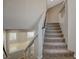 Carpeted staircase leads to an open upstairs living area with natural light at 5309 Tartan Hill Ave, Las Vegas, NV 89141