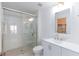 Bright bathroom featuring a glass shower and modern vanity at 5855 Valley Dr # 2018, North Las Vegas, NV 89031
