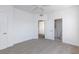 Bright bedroom with neutral carpet, white walls, and ceiling fan at 5855 Valley Dr # 2018, North Las Vegas, NV 89031
