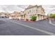 Two-story townhome with attached garage and tile roof in a community setting at 5855 Valley Dr # 2018, North Las Vegas, NV 89031