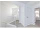 Upstairs hallway featuring neutral carpet and bright white trim at 5855 Valley Dr # 2018, North Las Vegas, NV 89031