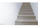 Carpeted stairs provide a safe and comfortable transition between floors of the house at 5855 Valley Dr # 2018, North Las Vegas, NV 89031