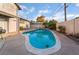 Serene pool surrounded by a patio offers a refreshing oasis for relaxation and entertainment at 608 Cragin Park Dr, Las Vegas, NV 89107