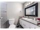 Bathroom featuring tiled floors, granite countertop, and modern fixtures at 608 Cragin Park Dr, Las Vegas, NV 89107