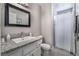 Bathroom with tiled floors, granite countertop, sink, toilet and shower with curtain at 608 Cragin Park Dr, Las Vegas, NV 89107