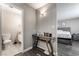 Bedroom with gray walls and wood floors that connects to the main bath at 608 Cragin Park Dr, Las Vegas, NV 89107