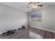 This bedroom offers a serene space with a ceiling fan, window, and stylish flooring at 608 Cragin Park Dr, Las Vegas, NV 89107
