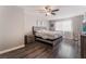 Primary bedroom with a neutral color palette, hardwood floors, and ample natural light at 608 Cragin Park Dr, Las Vegas, NV 89107