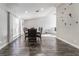 Spacious dining room with modern lighting and beautiful dark wood floors at 608 Cragin Park Dr, Las Vegas, NV 89107