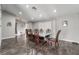 Open dining area featuring dark wood floors, modern lighting, and neutral paint at 608 Cragin Park Dr, Las Vegas, NV 89107