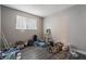 Empty bedroom featuring gray walls, laminate flooring, and natural light at 608 Cragin Park Dr, Las Vegas, NV 89107