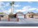 Traditional home boasting a spacious driveway, two-car garage, and brick accents at 608 Cragin Park Dr, Las Vegas, NV 89107