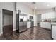 Spacious kitchen with stainless appliances, granite countertops, and white brick accent wall at 608 Cragin Park Dr, Las Vegas, NV 89107