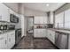 Well-equipped kitchen featuring stainless appliances, granite countertops, and modern cabinetry at 608 Cragin Park Dr, Las Vegas, NV 89107
