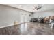 Neutral living room with modern ceiling fan, patio access, and unique decor at 608 Cragin Park Dr, Las Vegas, NV 89107