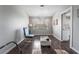 Bright living room with hardwood floors, modern lighting, and a view into the kitchen at 608 Cragin Park Dr, Las Vegas, NV 89107