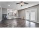 Open living space with hardwood floors, white walls and pass-through to kitchen at 608 Cragin Park Dr, Las Vegas, NV 89107