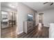 Spacious main bedroom featuring wood floors, gray walls, and stylish furniture at 608 Cragin Park Dr, Las Vegas, NV 89107