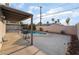Tranquil backyard pool area with patio and a lush surrounding landscape at 608 Cragin Park Dr, Las Vegas, NV 89107