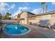 Backyard pool with clean blue water is surrounded by a concrete patio and mature landscaping at 608 Cragin Park Dr, Las Vegas, NV 89107