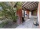 Covered porch featuring brick columns and a hanging swing at 608 Cragin Park Dr, Las Vegas, NV 89107