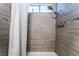 Modern shower with decorative tile and shower head at 608 Cragin Park Dr, Las Vegas, NV 89107