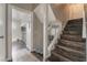 Stairway with wood-look floors and white railings at 608 Cragin Park Dr, Las Vegas, NV 89107