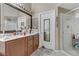 Bathroom featuring a double sink vanity and a glass-enclosed shower at 6278 Heather Creek Pl, Las Vegas, NV 89122