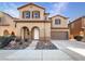 Charming two-story home with desert landscaping and a two-car garage at 7211 Hickory Post Ave, Las Vegas, NV 89179