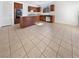 Bright kitchen featuring stainless steel appliances, an island, and tile flooring at 7211 Hickory Post Ave, Las Vegas, NV 89179
