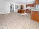 Open kitchen with wooden cabinets, a center island, and stainless steel appliances at 7211 Hickory Post Ave, Las Vegas, NV 89179