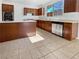 Well-lit kitchen with stainless steel appliances, wooden cabinets, and a kitchen island at 7211 Hickory Post Ave, Las Vegas, NV 89179