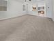 Large living room with a peek into the kitchen at 7211 Hickory Post Ave, Las Vegas, NV 89179