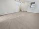 Expansive living room with neutral carpet and abundant natural light at 7211 Hickory Post Ave, Las Vegas, NV 89179