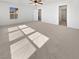 Spacious main bedroom with neutral carpet and a view to the backyard at 7211 Hickory Post Ave, Las Vegas, NV 89179