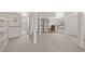 Unfinished basement area features storage shelving, concrete floor, and natural light at 736 N Kiel St, Henderson, NV 89015