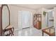 Bright entryway features tiled floors and a decorative front door with plenty of natural light at 736 N Kiel St, Henderson, NV 89015