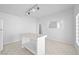 Bright kitchen with tiled island, modern appliances and bright lighting at 736 N Kiel St, Henderson, NV 89015