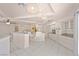 Open concept kitchen with white cabinets, granite countertops, and bar stool seating at 736 N Kiel St, Henderson, NV 89015