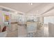 Bright open concept kitchen with bar seating and stainless steel appliances at 736 N Kiel St, Henderson, NV 89015