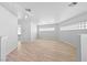 Spacious, light-filled living room featuring modern vinyl floors and light walls with neutral accents at 736 N Kiel St, Henderson, NV 89015